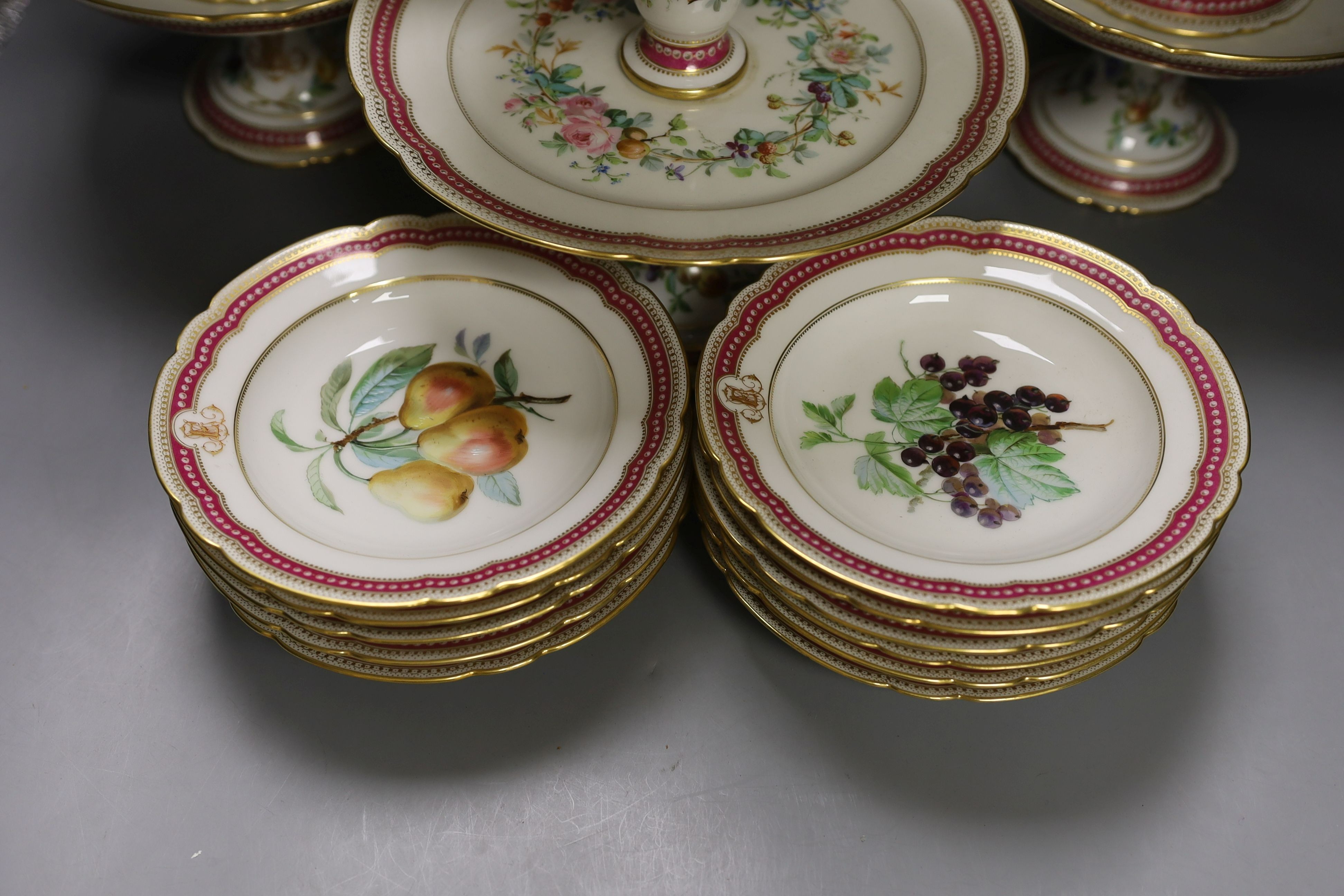 A late 19th century Paris porcelain floral part dessert service, with 2 pairs of comports, a three tier cake stand and eleven dishes.